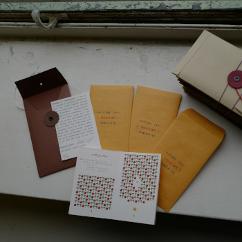 Handmade envelope, author’s note, three envelopes for each zine, and zine #3 open to show code and output.
